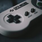 selective focus photography of SNES controller