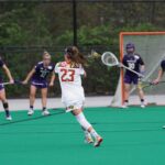 girls playing lacrosse game